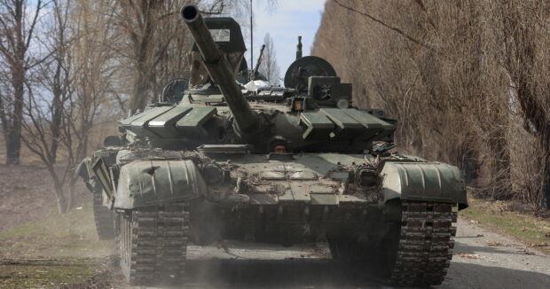image-ukrainian-service-member-drives-a-captured-russian-t-72-tank-in-lukianivka