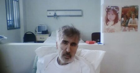 image-georgias-jailed-ex-president-mikheil-saakashvili-is-seen-on-a-screen-during-a-court-hearing-in-tbilisi