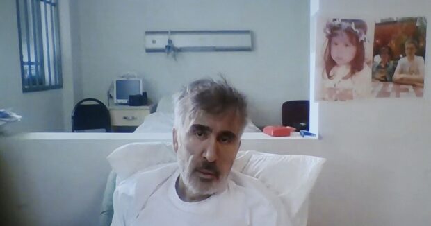 image-georgias-jailed-ex-president-mikheil-saakashvili-is-seen-on-a-screen-during-a-court-hearing-in-tbilisi